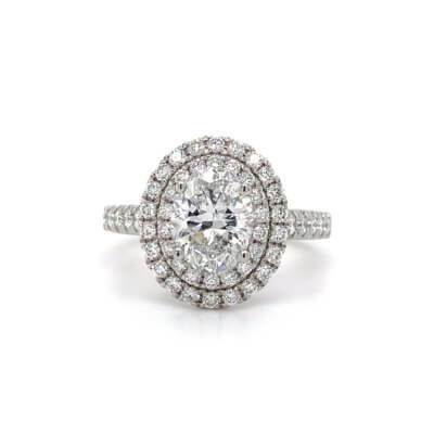 Pre-Owned 1.54ct Oval cut Diamond with Diamond halo and shoulders Engagement ring set in Platinum