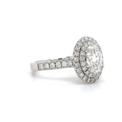 Pre-Owned 1.54ct Oval cut Diamond with Diamond halo and shoulders Engagement ring set in Platinum