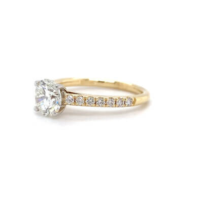 Pre-Owned 1.22ct Round Brilliant cut Diamond Engagement ring with Diamond set shoulders made in 18ct Gold